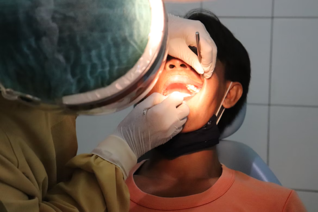 a dentist performing a dental procedure